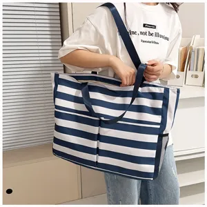 Large capacity blue and white striped canvas tote bag, casual shoulder bag detail view.