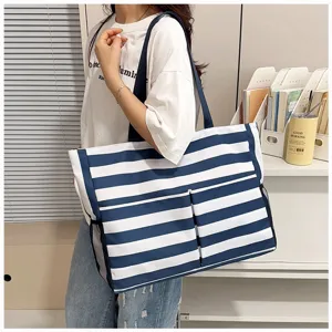 Korean style casual blue and white striped canvas tote bag with front pockets and large capacity.