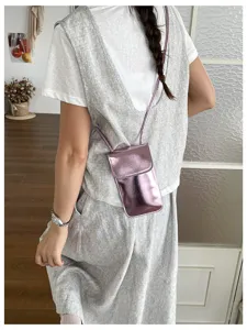 Glossy vertical mini crossbody phone bag for women, stylish phone pouch for daily use.