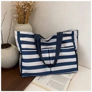 Canvas tote bag detail view, stylish blue and white striped pattern, large capacity.