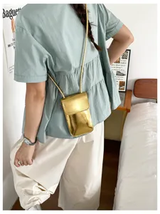 Glossy gold mini phone crossbody bag, trendy vertical square purse for women summer outfit.