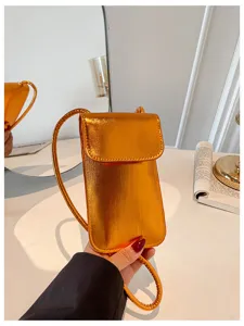 Metallic orange mini vertical phone crossbody bag for women, stylish spring summer daily use.