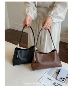 Minimalist PU leather underhand shoulder bag for women, stylish commuter tote for summer.