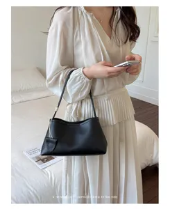 Minimalist black shoulder bag for women, stylish underarm purse with elegant minimalist vibe.