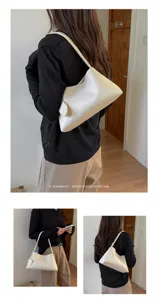 Minimalist white underarm bag for women, chic shoulder purse, stylish commuter tote bag daily.