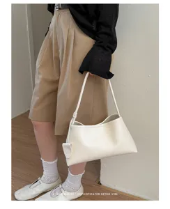 Minimalist solid color shoulder underarm bag for women, sleek retro style daily use.
