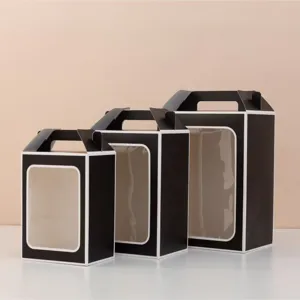Set of black portable paper gift boxes with transparent window in three distinct sizes