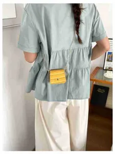 Trendy yellow mini crossbody bag for women, cute croc embossed chain shoulder purse style.