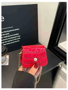 Red mini crossbody bag for women, trendy stone pattern lipstick bag with metal chain strap.