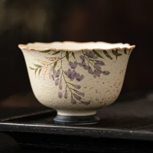 Hand-painted purple wisteria ceramic tea cup with gold trimming for home tea tasting.