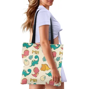 Fashionable canvas tote bag with cute cartoon dinosaur print, casual shoulder bag for daily use.