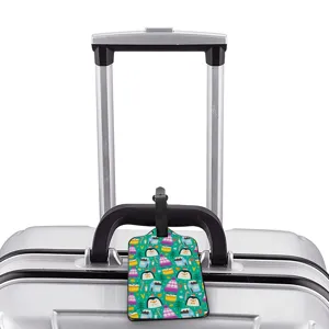 Cute cartoon penguin pattern luggage tag for travel suitcases with black strap identifier.