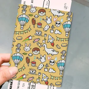 Cute cartoon doodle PU leather passport holder, stylish travel document organizer for women men
