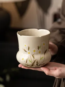 Hand-painted ceramic tea wash bowl with daisy pattern, exquisite tea ceremony accessory.