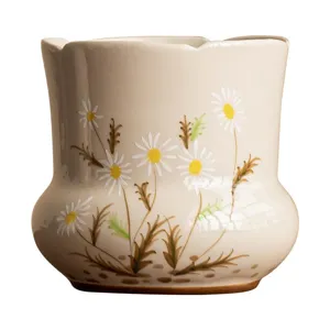 Hand-painted ceramic tea waste bowl with lovely daisy floral pattern for tea ceremony use.