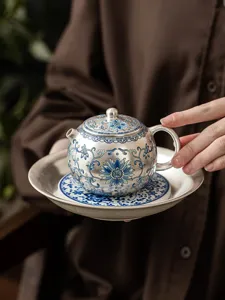 Silver plated ceramic teapot with exquisite blue floral pattern and lucky character detail.