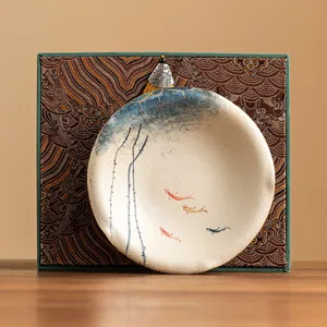 Hand-painted ceramic teapot coaster with koi and lotus design, exquisite tea mat main view.