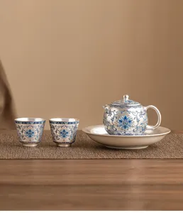Silver plated ceramic kung fu tea set with one teapot and two cups for tea lovers.