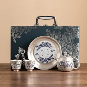Luxe 999 verzilverde thee set cadeauverpakking met prachtige theepot kopjes en schotel.