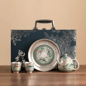 Exquisite silver-plated fish and algae tea set with luxury gift box for tea lovers.
