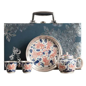 Luxury goldfish pattern silver-plated ceramic tea set gift box with teapot and two cups.