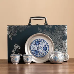 Silver-plated ceramic kung fu tea set gift box with teapot cups and tray for home use.