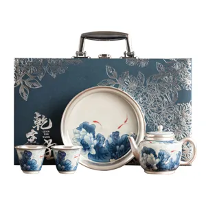 Juego de té de cerámica plateada tetera tazas caja de regalo diseño de loto pez
