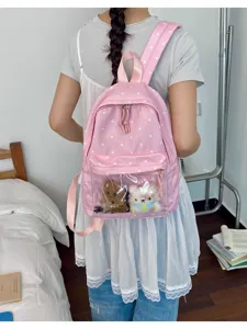 Sweet pink polka dot backpack with clear front pocket and cute plush toys for school and travel use.
