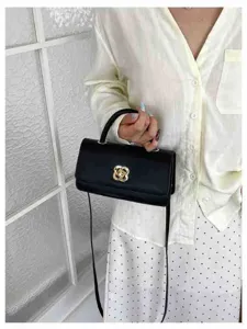 Elegante borsa a spalla nera da donna con chic chiusura a fiore dorata e cinturino.