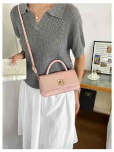 Chic borsa a tracolla rosa da donna, borsa elegante con raffinata chiusura floreale.