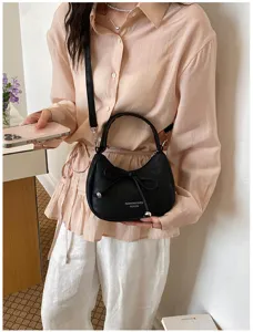 Borsa a tracolla nera alla moda per donna, design con fiocco elegante, borsa chic.