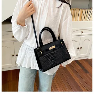 Classic black top handle shoulder bag with crocodile texture and metal lock design for women.