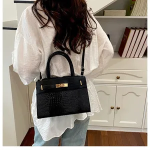 Black crocodile embossed PU leather tote bag with top handle and stylish metal turn lock closure.