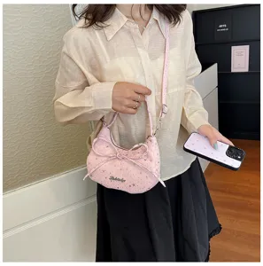 Chic pink star pattern dumpling crossbody bag with bow detail for women daily fashion.