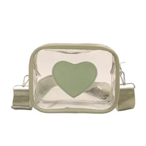Sac bandoulière en PVC transparent avec motif de cœur vert et large sangle tendance.