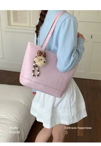 Pink PU leather tote bag for women, large capacity casual shoulder bag with cute bear charm.