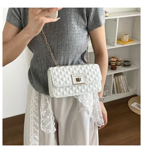 White quilted chain shoulder bag, stylish crossbody bag with metal lock and strap.