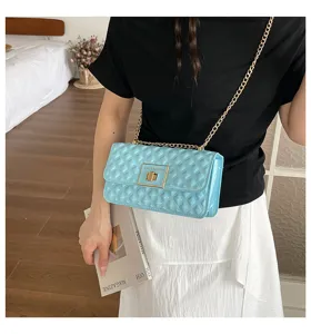 Light blue quilted chain shoulder bag, stylish crossbody bag with metal lock for women.