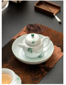 Handbemalte grüne Bambus Keramik Teekanne Untertasse Detail, exquisite Teezubehör Matte.