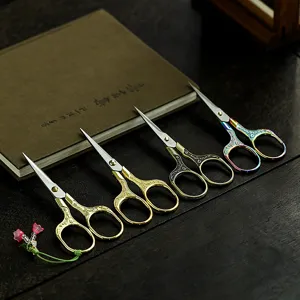 Vintage Chinese style tea scissors set with plum blossom carving, perfect kung fu tea accessories.