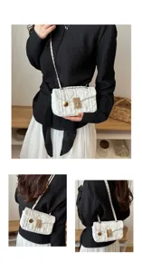 Detailed view of women's white quilted chain shoulder bag with metallic lock and strap.