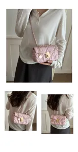 Pink quilted chain shoulder bag detail shot showcasing exquisite stitching and hardware.