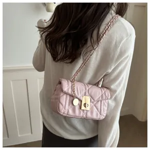 Pink quilted chain shoulder bag for women, stylish crossbody handbag with turn-lock.