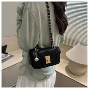 Women's quilted chain shoulder bag, elegant black crossbody bag with metal lock detail.