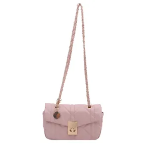 Pink quilted leather crossbody bag with chic gold chain strap, ideal women fashion purse.