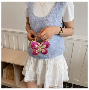 Sparkling pink acrylic butterfly evening bag with gold chain strap for women fashion party clutch.