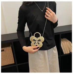 Sparkling crystal butterfly evening bag with chain strap, luxury metallic acrylic crossbody clutch.