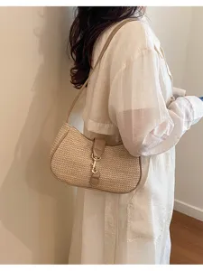 Woven straw shoulder bag underarm hobo purse with metal closure for women daily stylish commute use.