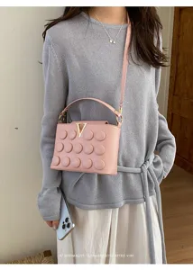 Borsa a tracolla a bolle rosa da donna, elegante borsa retrò con chiusura in metallo a V.