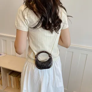 Mini acrylic evening bag with chain strap and shiny glitter design for women fashion.